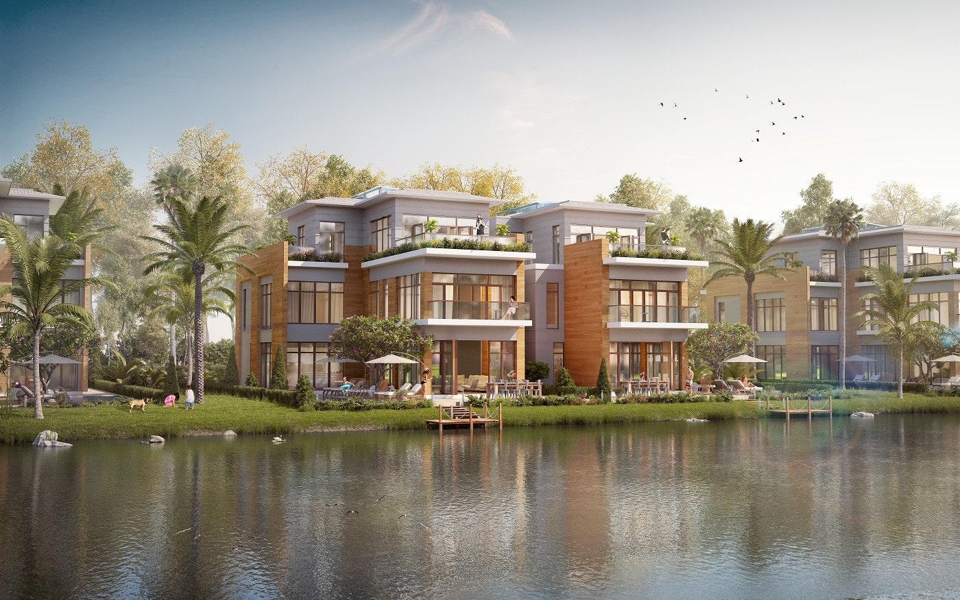 Alluvia City Văn Giang 14 Hình ảnh phối cảnh của các biệt thự đảo hiện đại tại Alluvia City, tọa lạc dọc theo hồ nước yên ả với cây cọ, cây xanh và mọi người đang tận hưởng không gian ngoài trời.